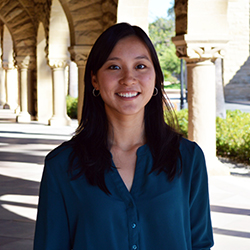 Alexa Siu, a woman smiling, with black hair and a blue color shirt.