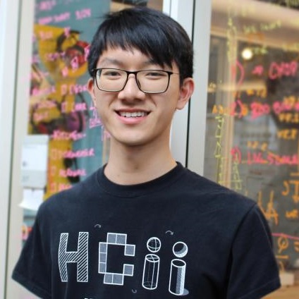 Jason Wu is an Asian man wearing glasses and a black HCII t-shirt